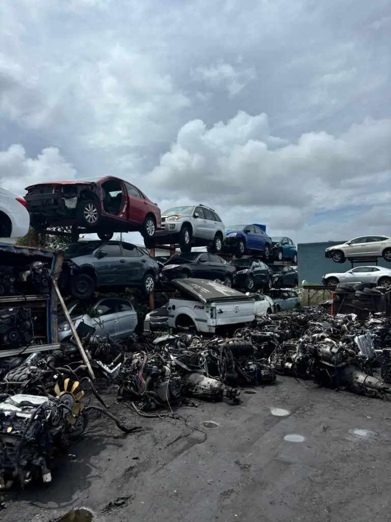 Junk cars and trucks awaiting pickup in a local salvage yard